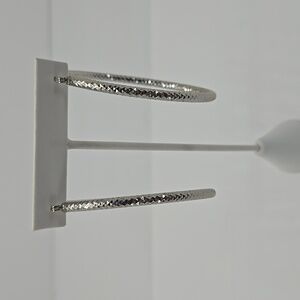 Large silver toned hoop earrings